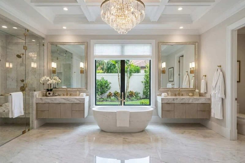 Luxury bathroom design with marble walls, freestanding bathtub, and modern lighting